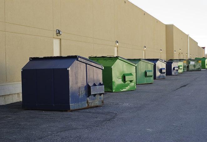 a group of construction workers taking a break near a dumpster in Clyde, OH